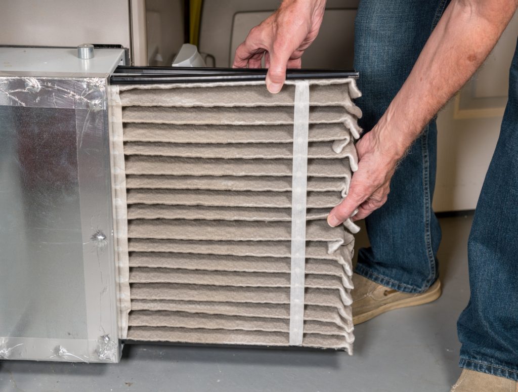 Changing a dirty air filter in a Furnace